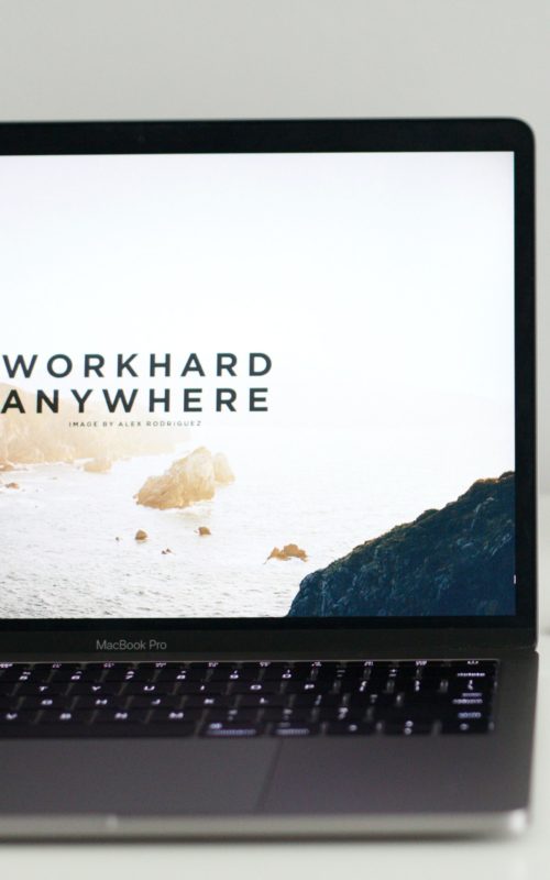 Laptop screen with "work hard anywhere" and a picture of islands in the background. Use Steady to get remote work.
